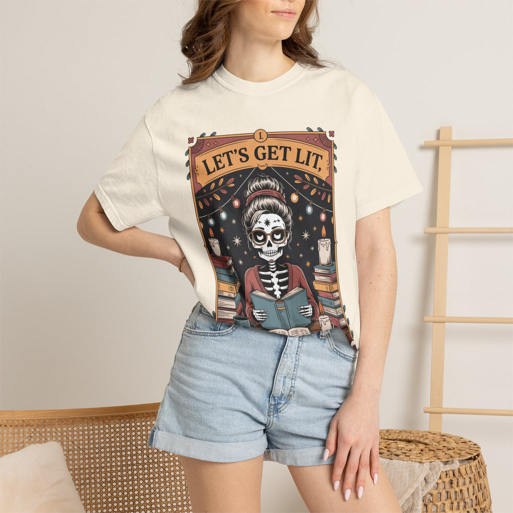 Person wearing a t-shirt with a skeleton reading a book graphic and 'Let's Get Lit' text.