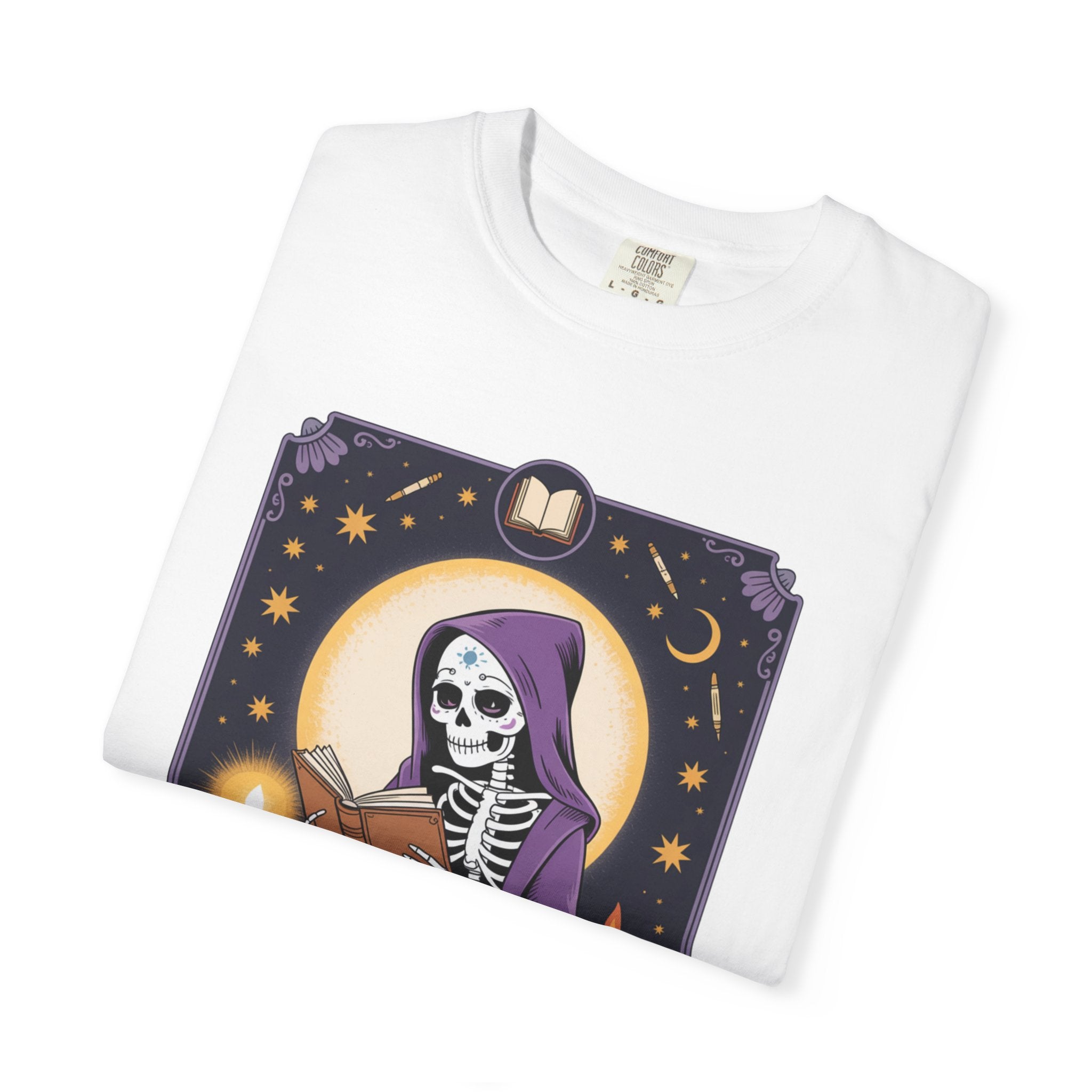 White t-shirt with a skeleton and book design on a white background