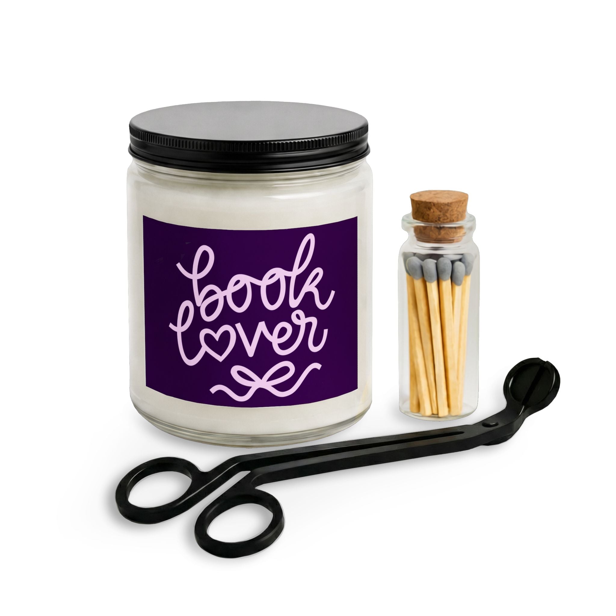 Candle jar labeled 'book lover' with a match container and scissors on a white background