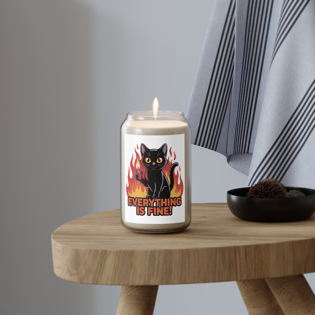 Candle with a black cat design and 'Everything is Fine!' text on a wooden table.