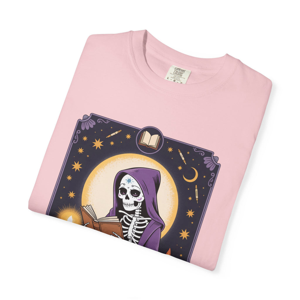Pink t-shirt with a skeleton and book design on a white background