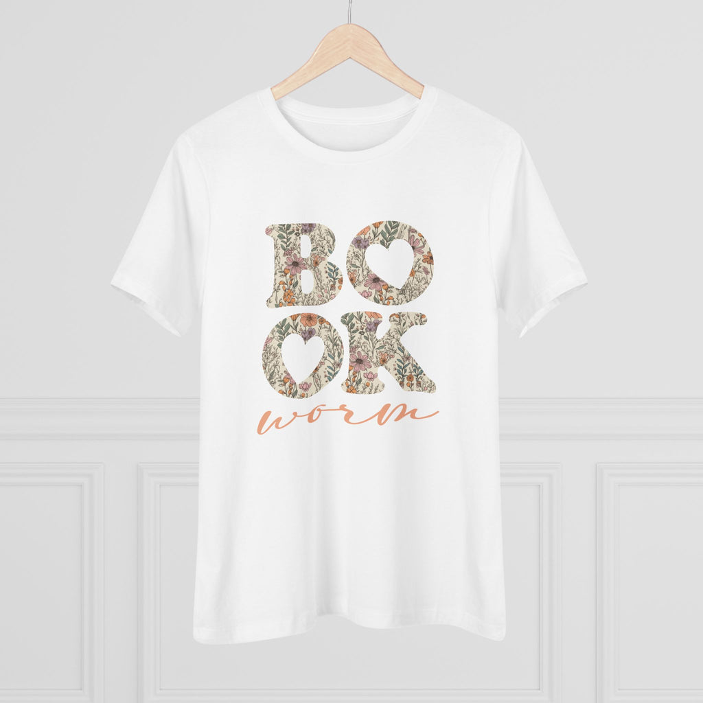 White t-shirt with floral text 'BOOK worm' on a hanger against a light gray background