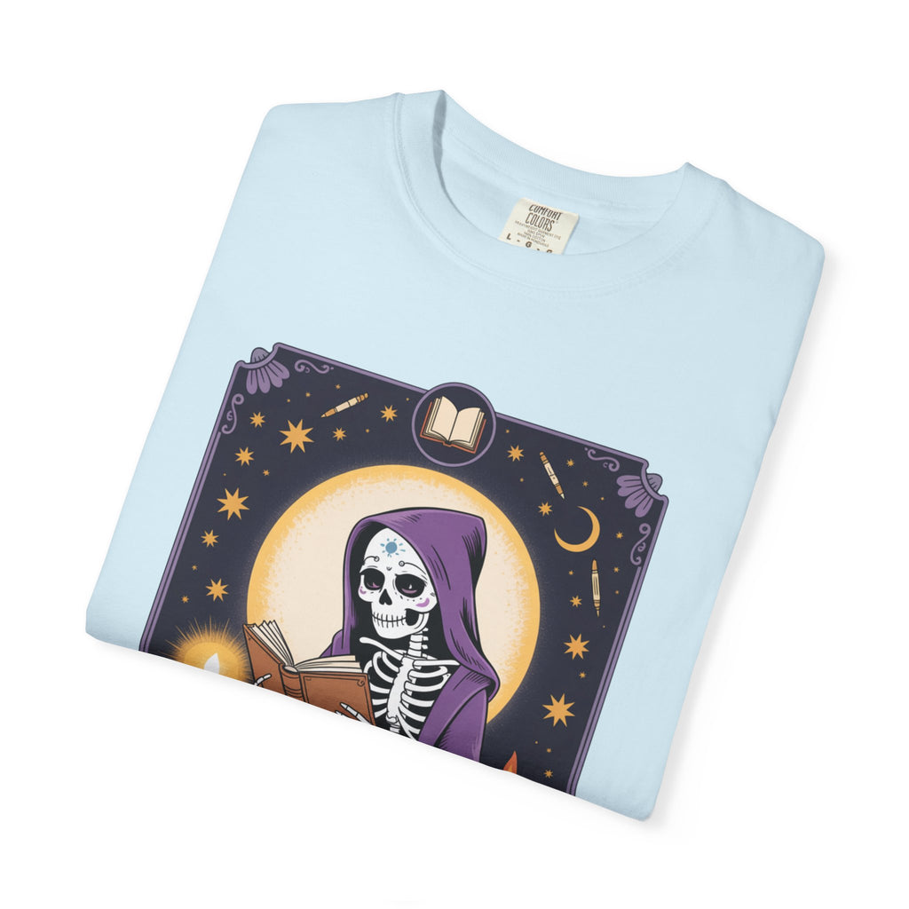 Light blue t-shirt with a skeleton and book design on a white background