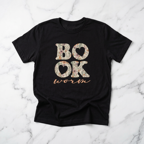 Black t-shirt with floral 'BOOK WORM' text on a marble background