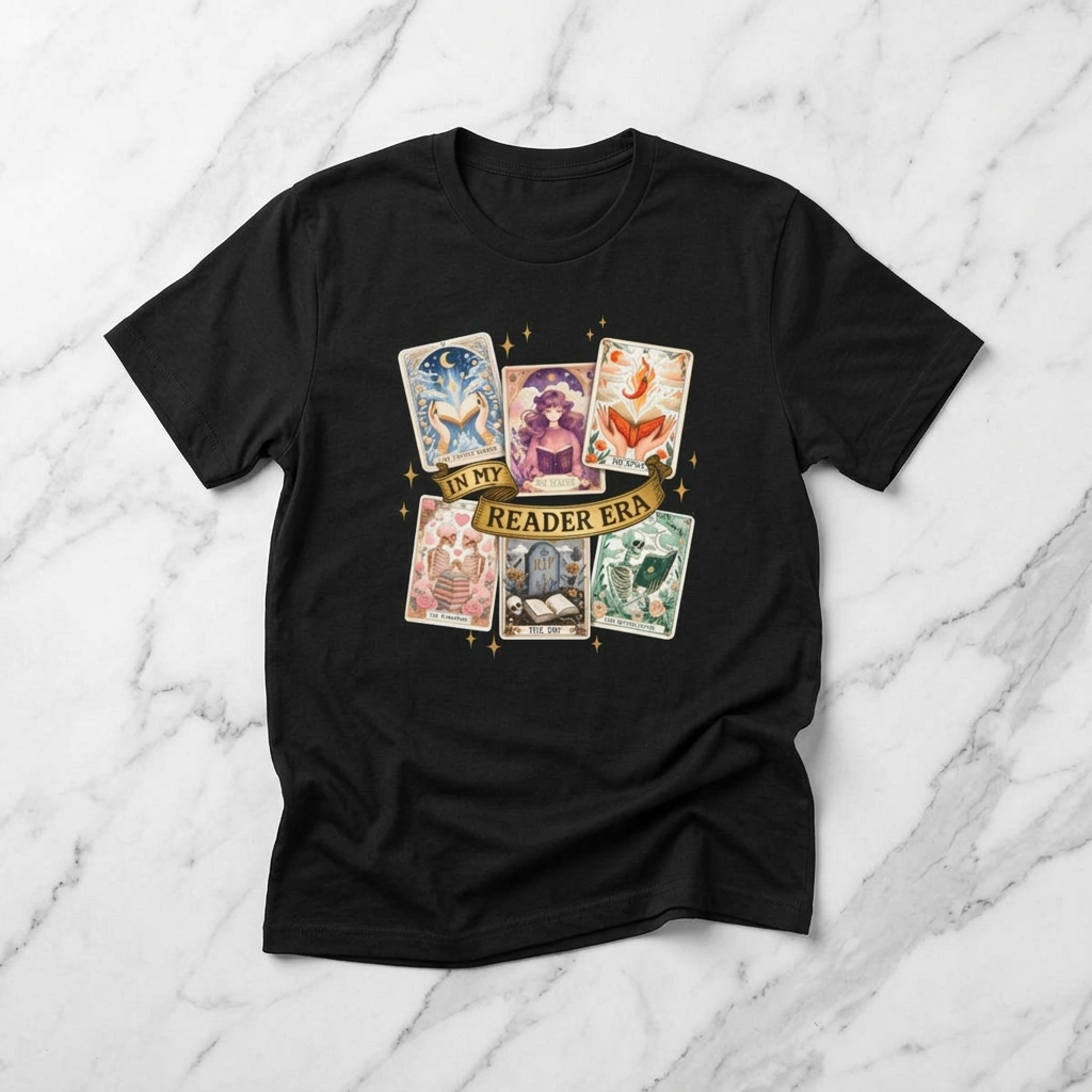 Black t-shirt with tarot card designs and 'Reader Era' text on a marble surface