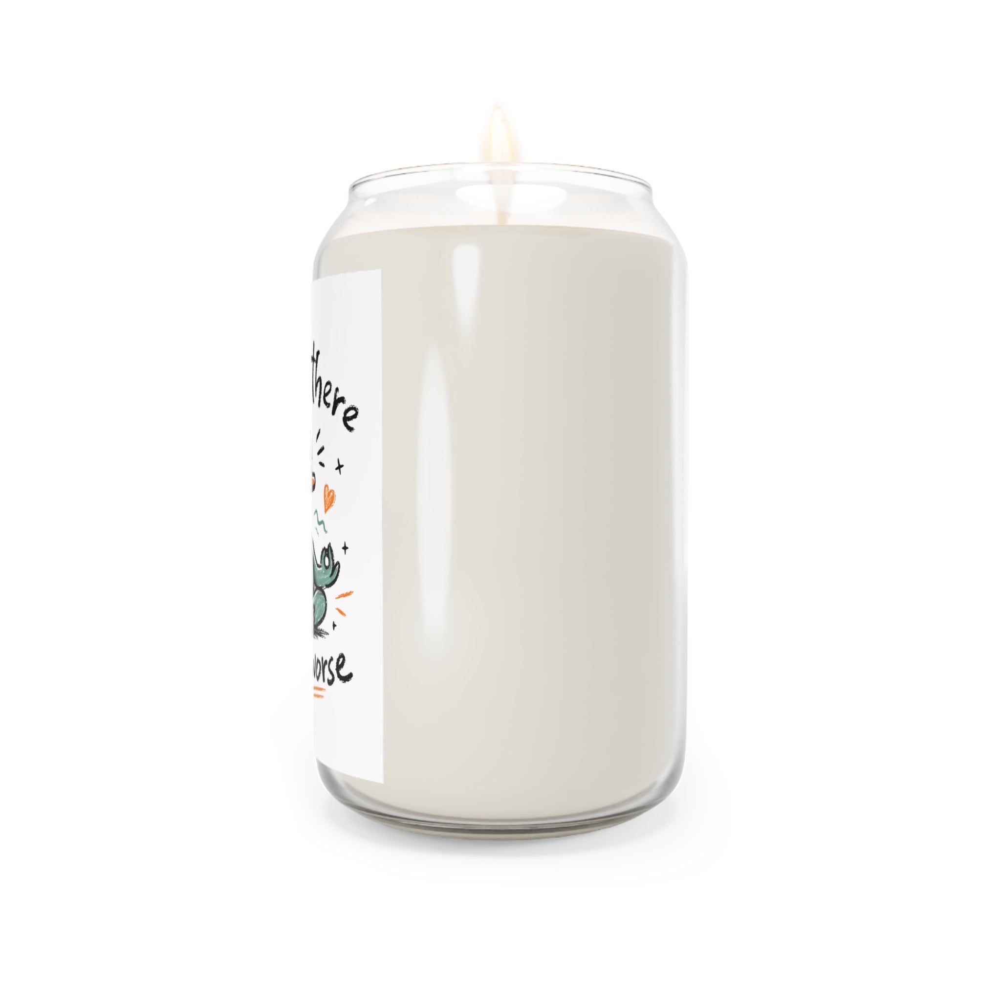 White candle in a glass jar with a label on a white background