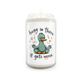 Candle with a cartoon duck and text on a white background